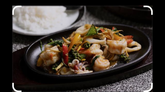 Sizzling Seafood with Basil Sauce.